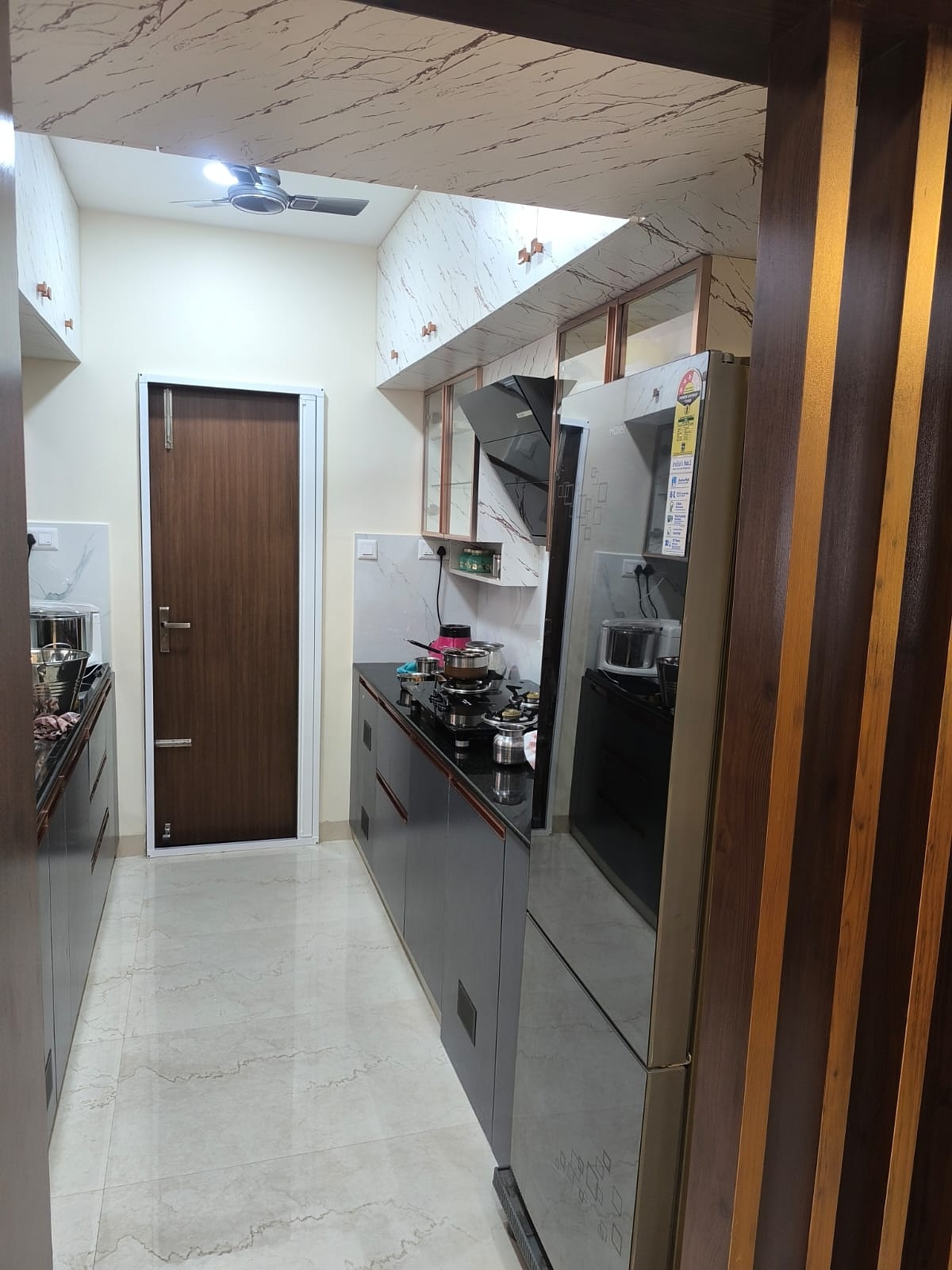 Galley kitchen with grey cabinets