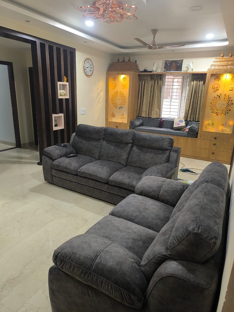Living room sofa with pooja cabinets