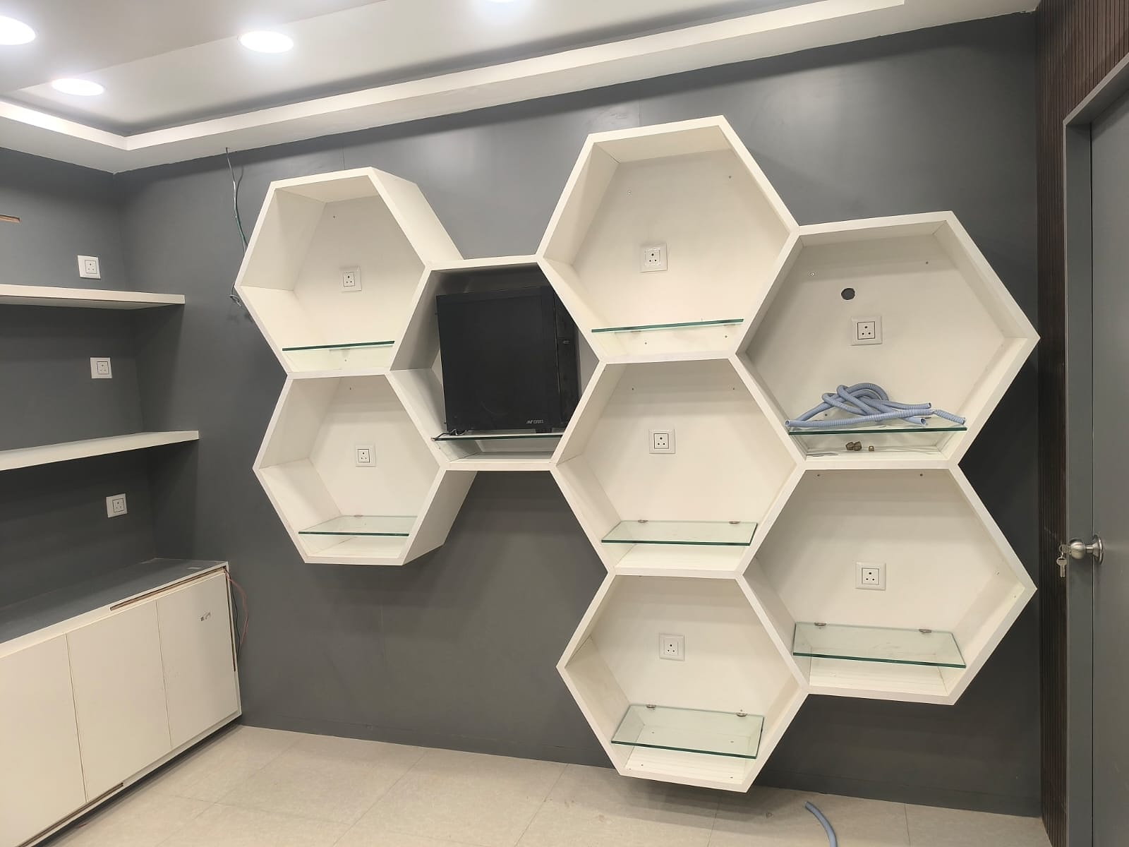 Hexagon display shelf unit with TV mount cutout